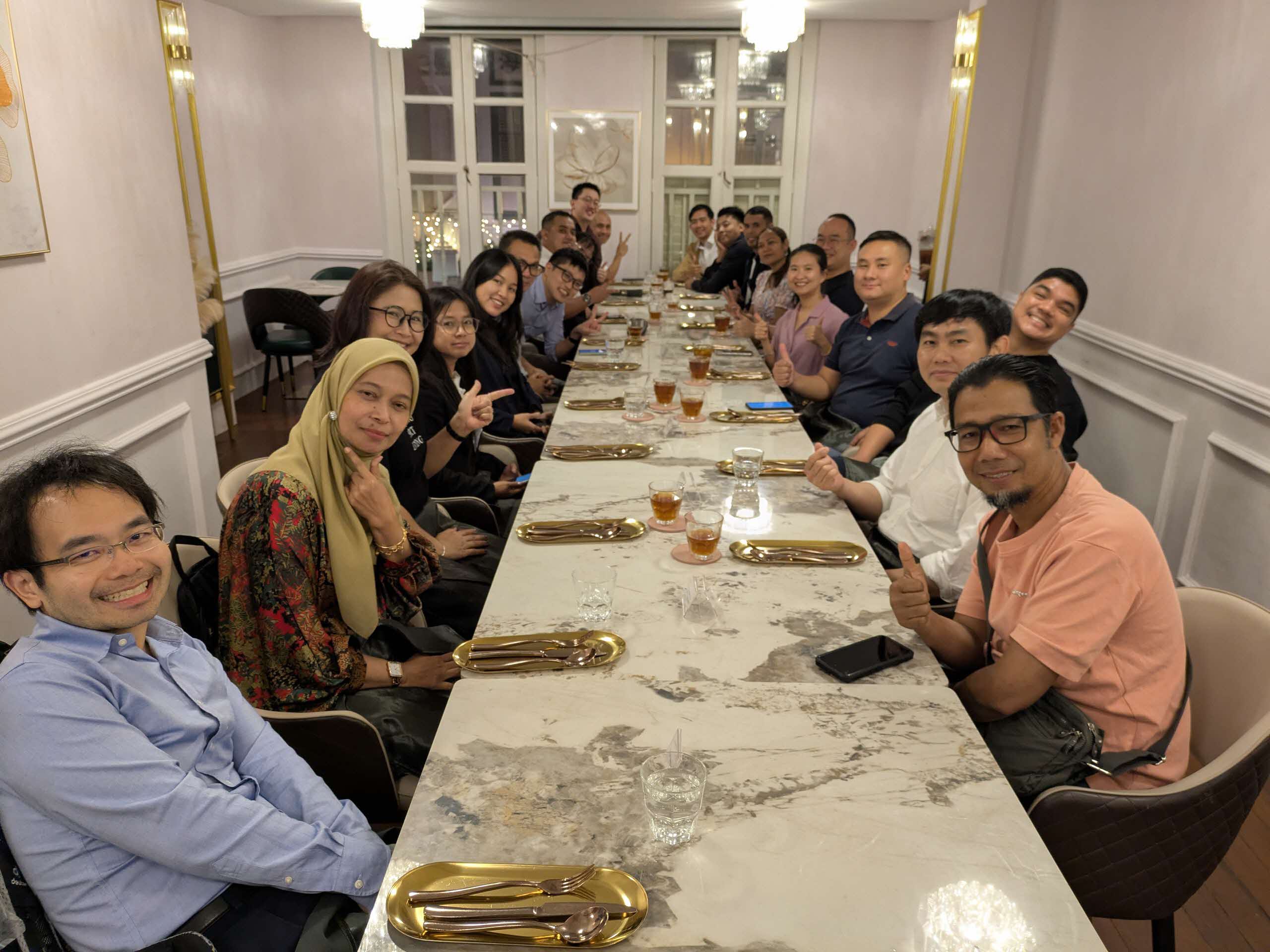 Figure 4: ASMC staff and participants at a welcome dinner.